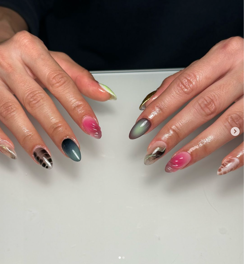 Gel manicure with gradient colors and intricate designs at a nail salon in Vancouver